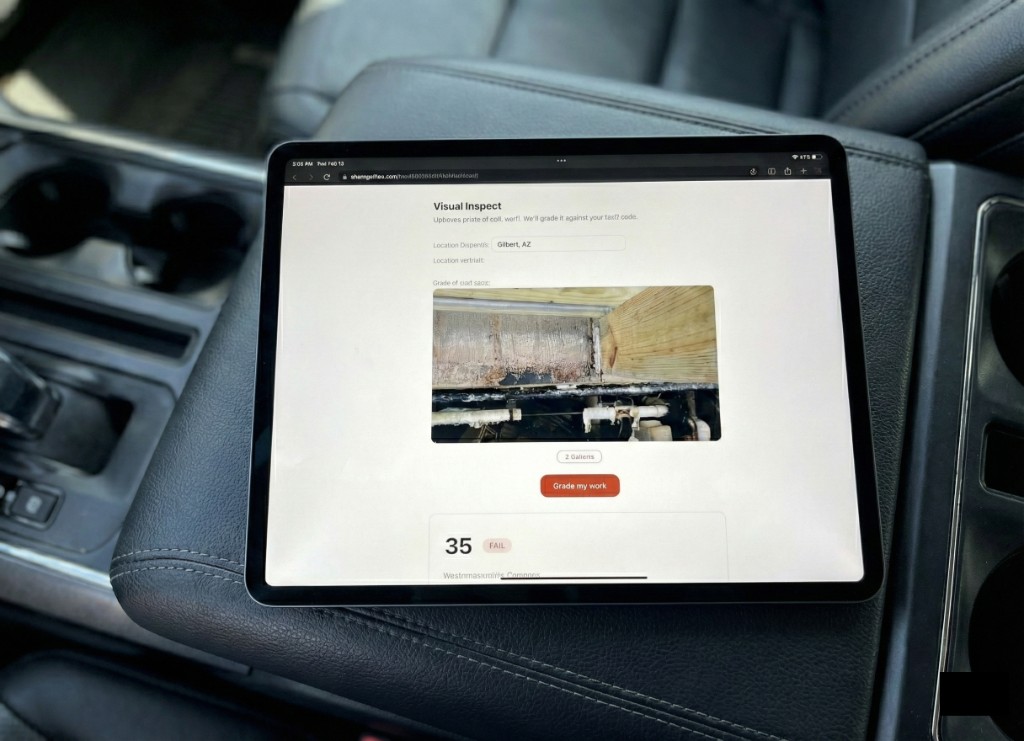 iPad displaying FluxPro Visual Inspect app for grading work against code